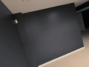 Dark gray painted interior wall with clean edges and neutral ceiling trim